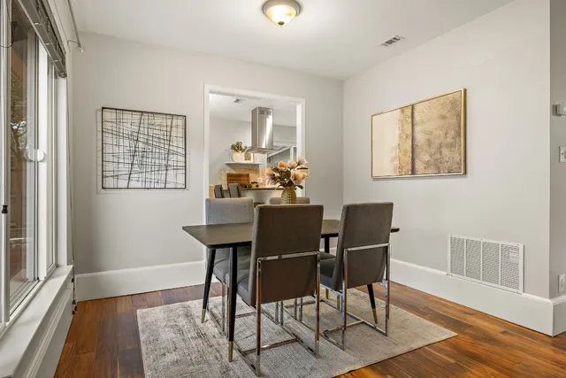 a view of a dining room with furniture window and wooden floor