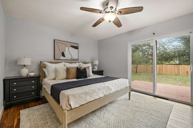a bedroom with a large bed and a large window