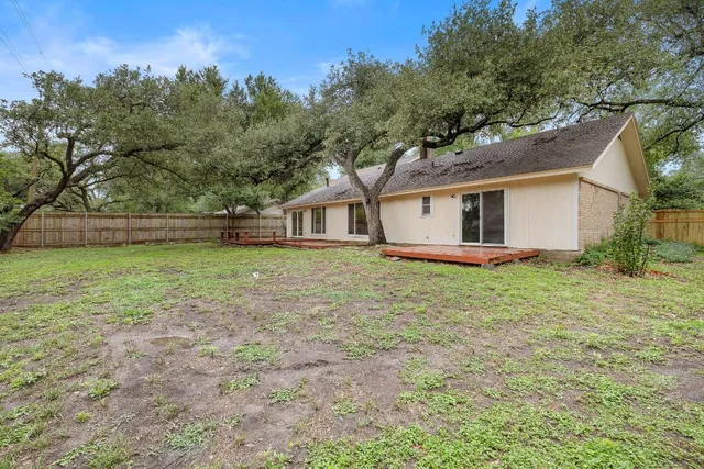 a view of a park with large trees