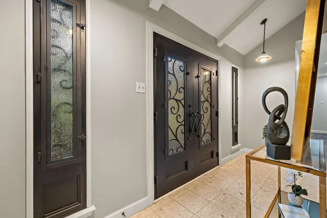 a view of a entryway door front of a house
