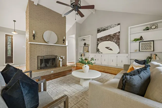 a living room with furniture and a fireplace