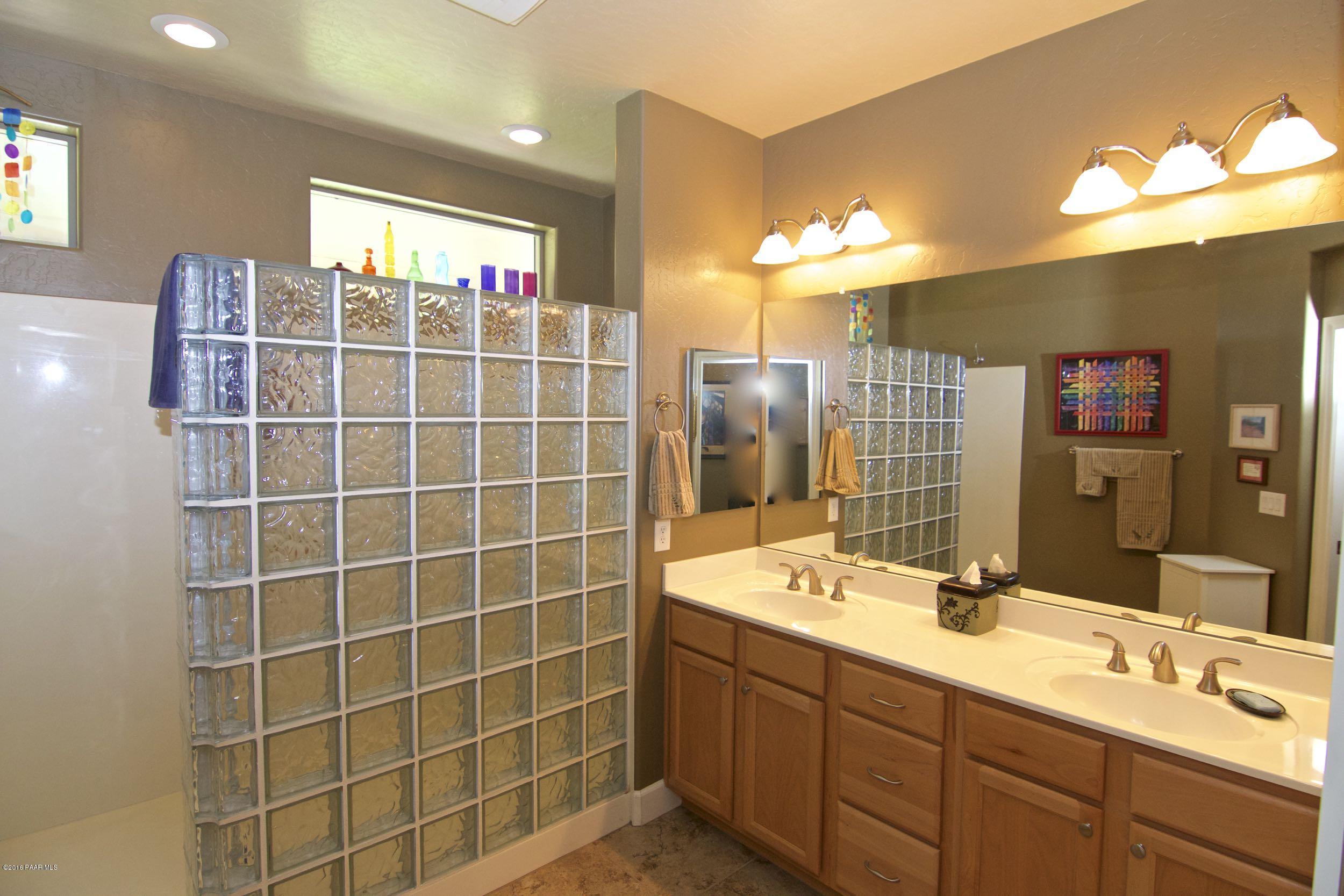 1157 Rusty Nail Road Prescott Valley, AZ 86314 - Photo 21 of 45 a bathroom with a double vanity sink mirror and double