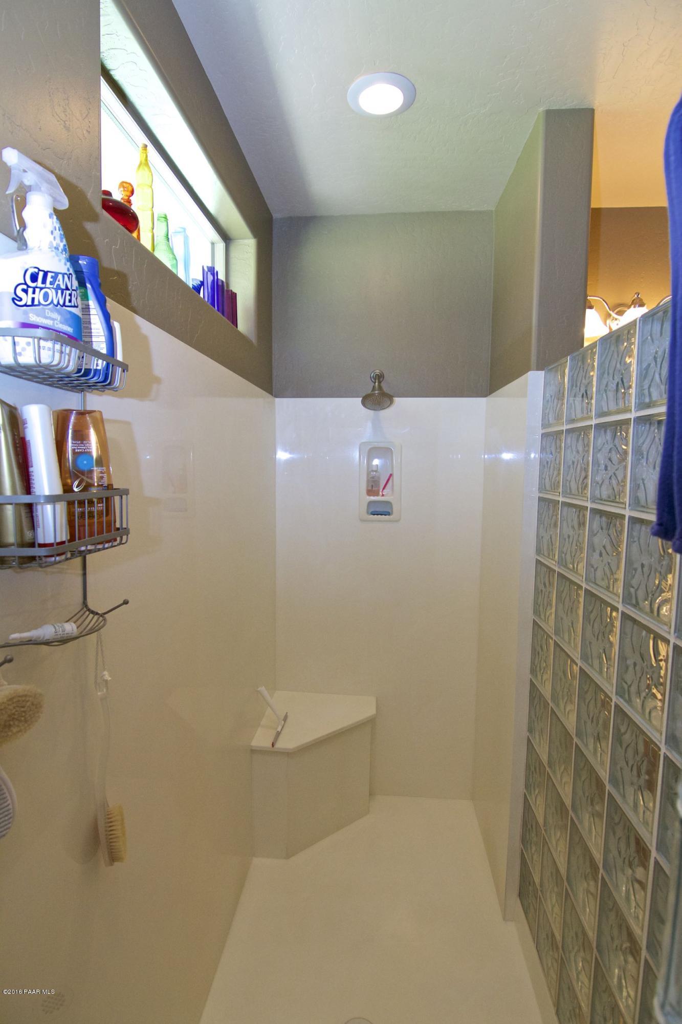1157 Rusty Nail Road Prescott Valley, AZ 86314 - Photo 22 of 45 a bathroom with a toilet and a shower
