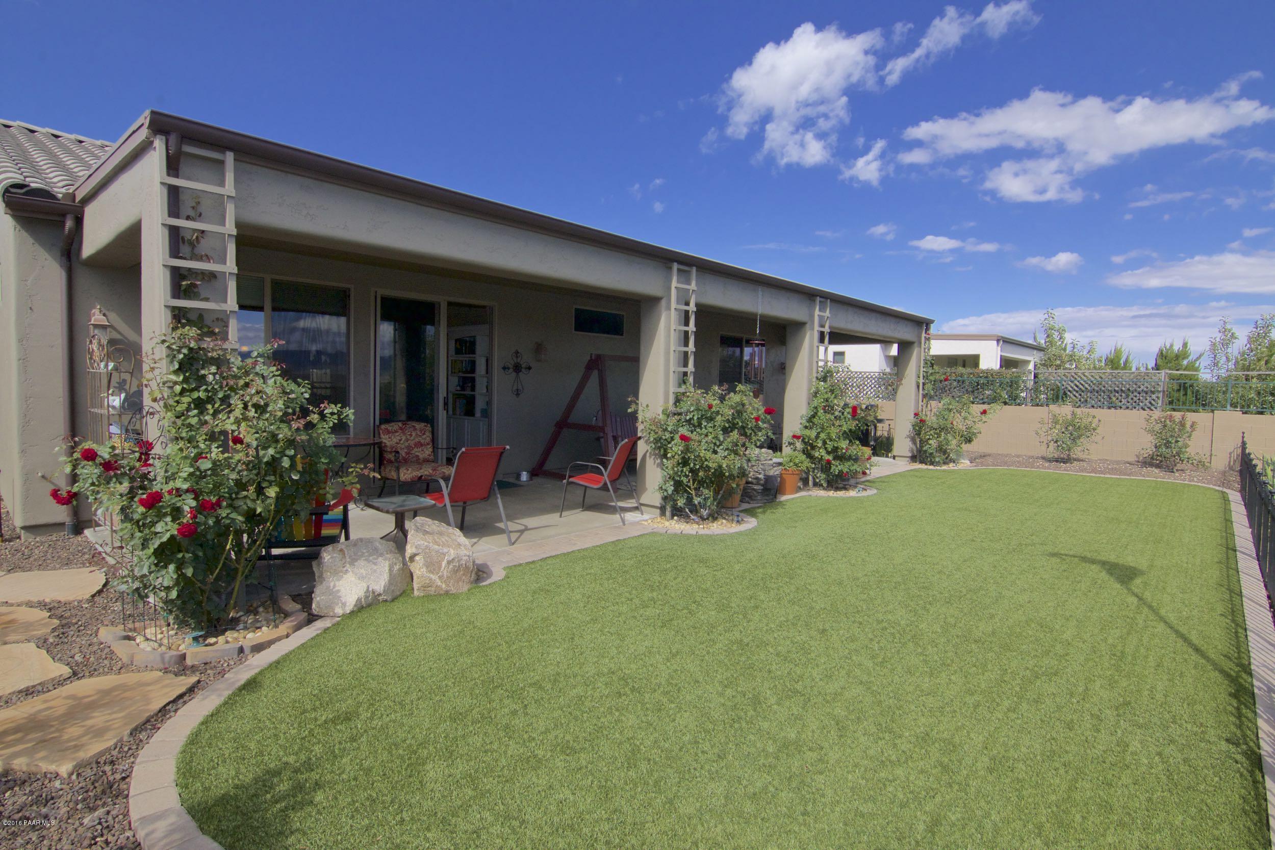1157 Rusty Nail Road Prescott Valley, AZ 86314 - Photo 26 of 45 a view of a house with porch and garden