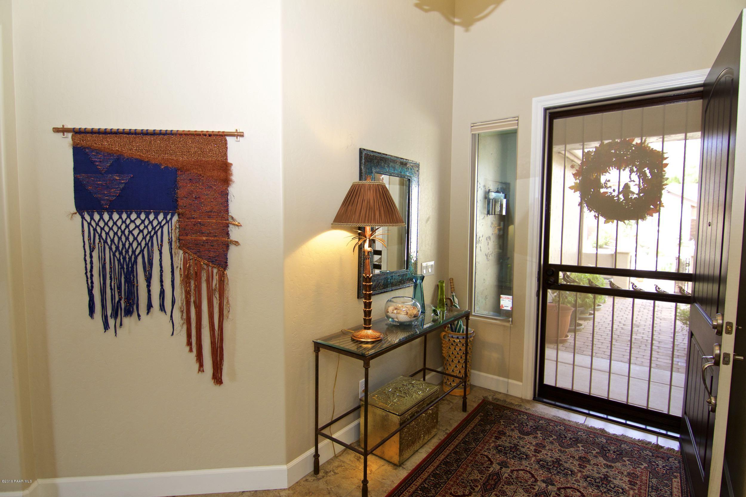 1157 Rusty Nail Road Prescott Valley, AZ 86314 - Photo 29 of 45 a view of a hallway with windows