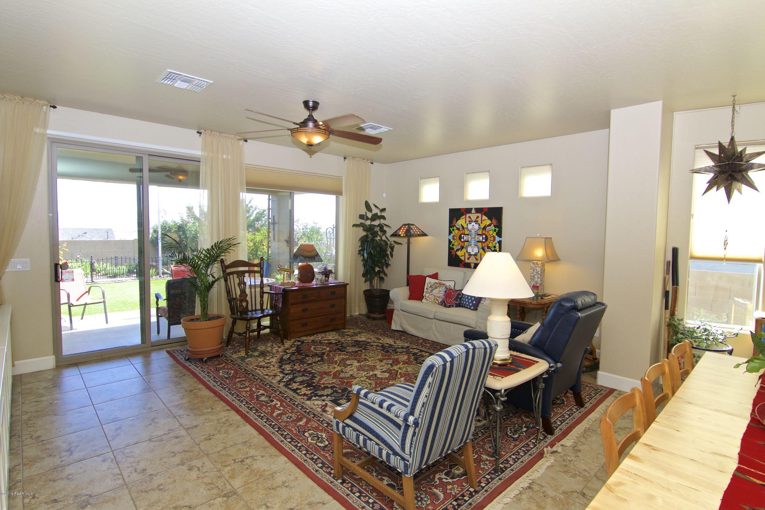 1157 Rusty Nail Road Prescott Valley, AZ 86314 - Photo 3 of 45 a living room with furniture and a large window