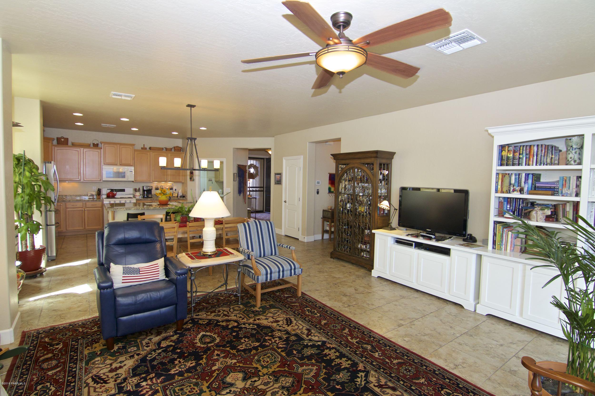1157 Rusty Nail Road Prescott Valley, AZ 86314 - Photo 4 of 45 a living room with furniture and a flat screen tv