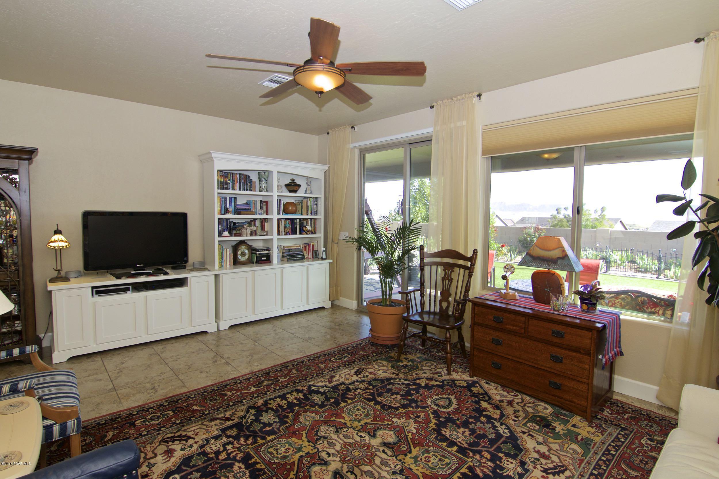 1157 Rusty Nail Road Prescott Valley, AZ 86314 - Photo 8 of 45 a living room with furniture and a flat screen tv