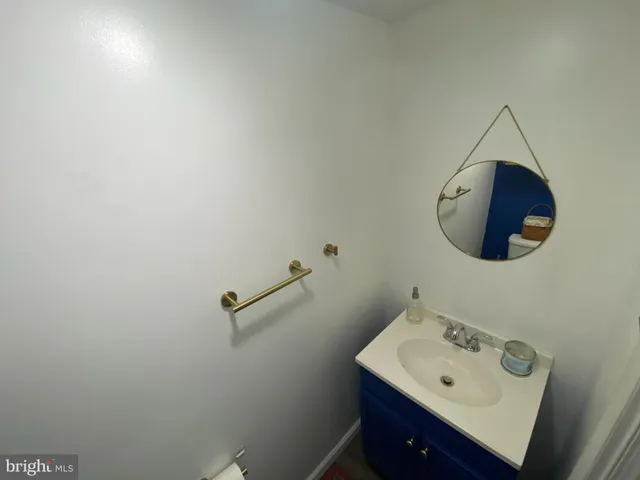 a bathroom with a sink and mirror