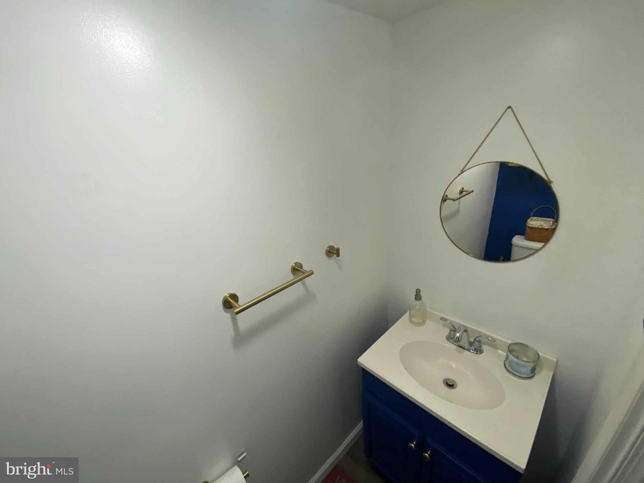 3850 Woodhaven Road, Unit 1012 Philadelphia, PA 19154 - Photo 5 of 16 a bathroom with a sink and mirror