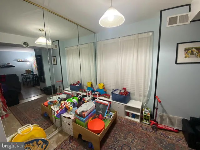 a living room filled with furniture and a chandelier