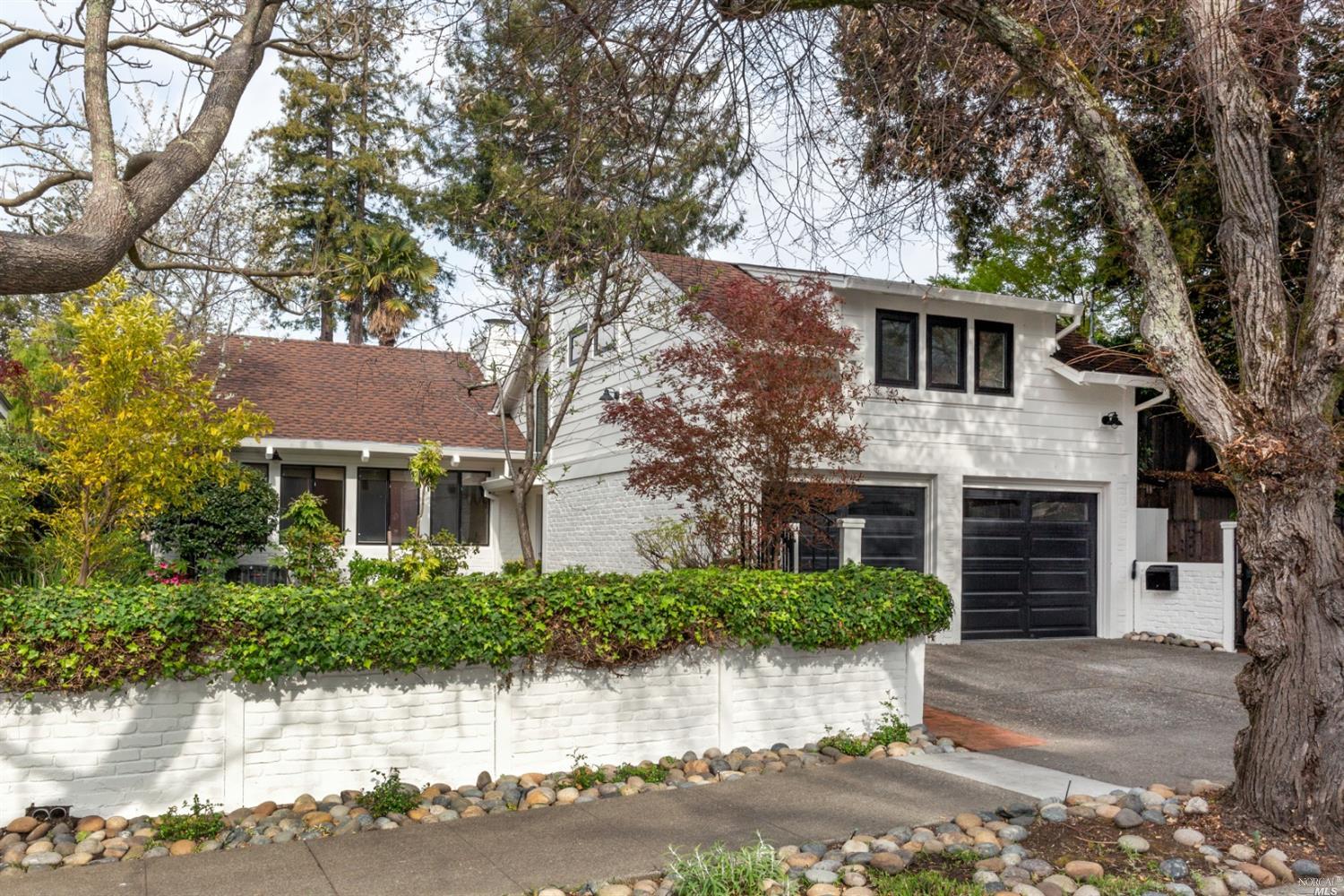 325 H Street San Rafael, CA 94901 - Photo 1 of 1 a front view of a house with a garden