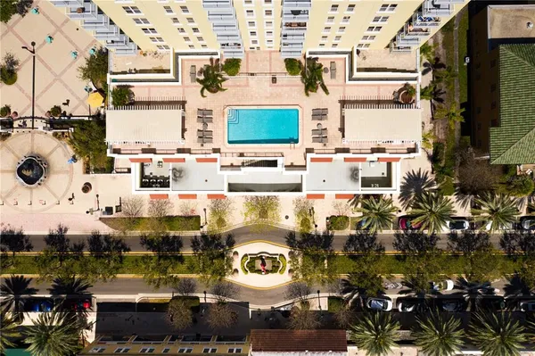 a swimming pool view with a outdoor seating space