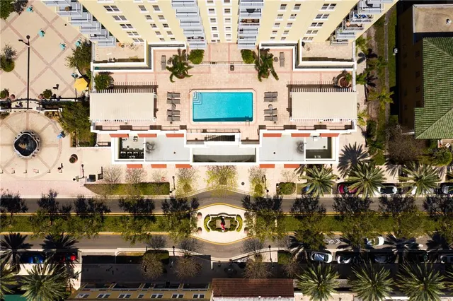 a swimming pool view with a outdoor seating space