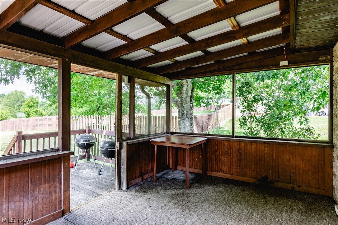 279 Spence Road Belpre, OH 45714 - Photo 32 of 40 Unfurnished sunroom featuring a wealth of natural light and lofted ceiling with beams