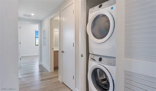a bathroom with a granite countertop sink a mirror and shower