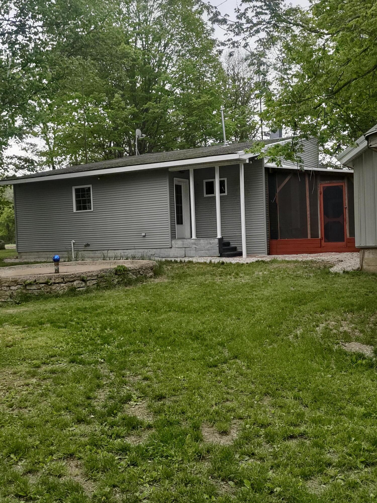 6667 6 1/2 Mile Road East Leroy, MI 49051 - Photo 3 of 22 6 one half mile rd. back view of home