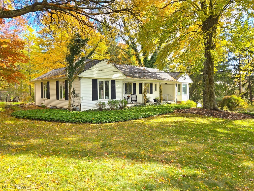4639 Brainard Road Chagrin Falls, OH 44022 - Photo 4 of 50 Diagonal view of home with landscaping and front porch.
