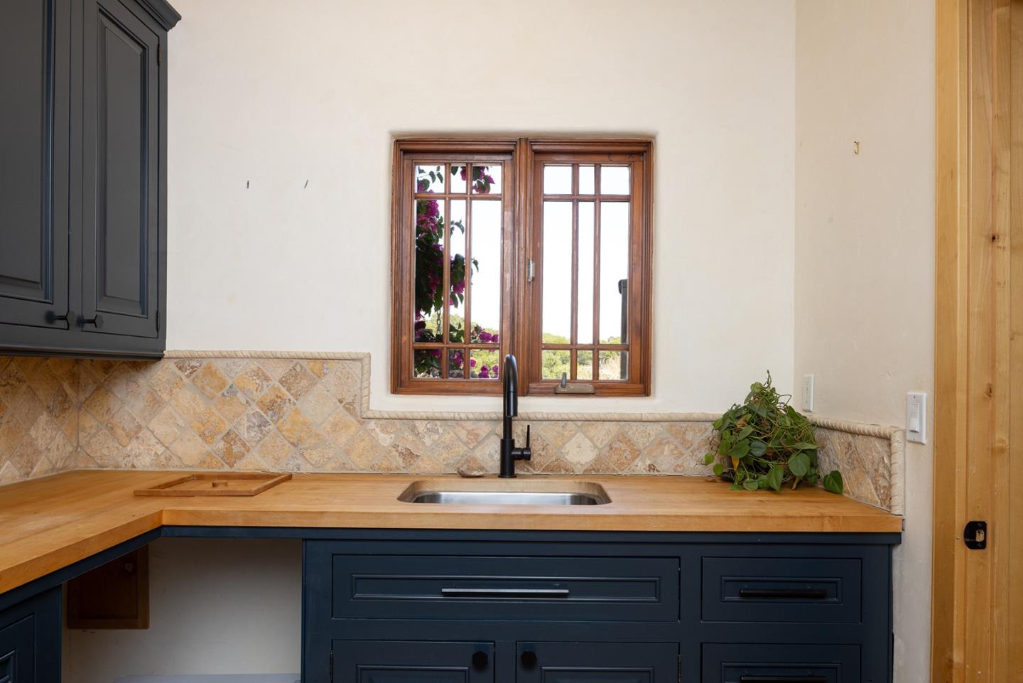 175 Chaparral Road Carmel Valley, CA 93924 - Photo 14 of 40 a kitchen with a sink and cabinets