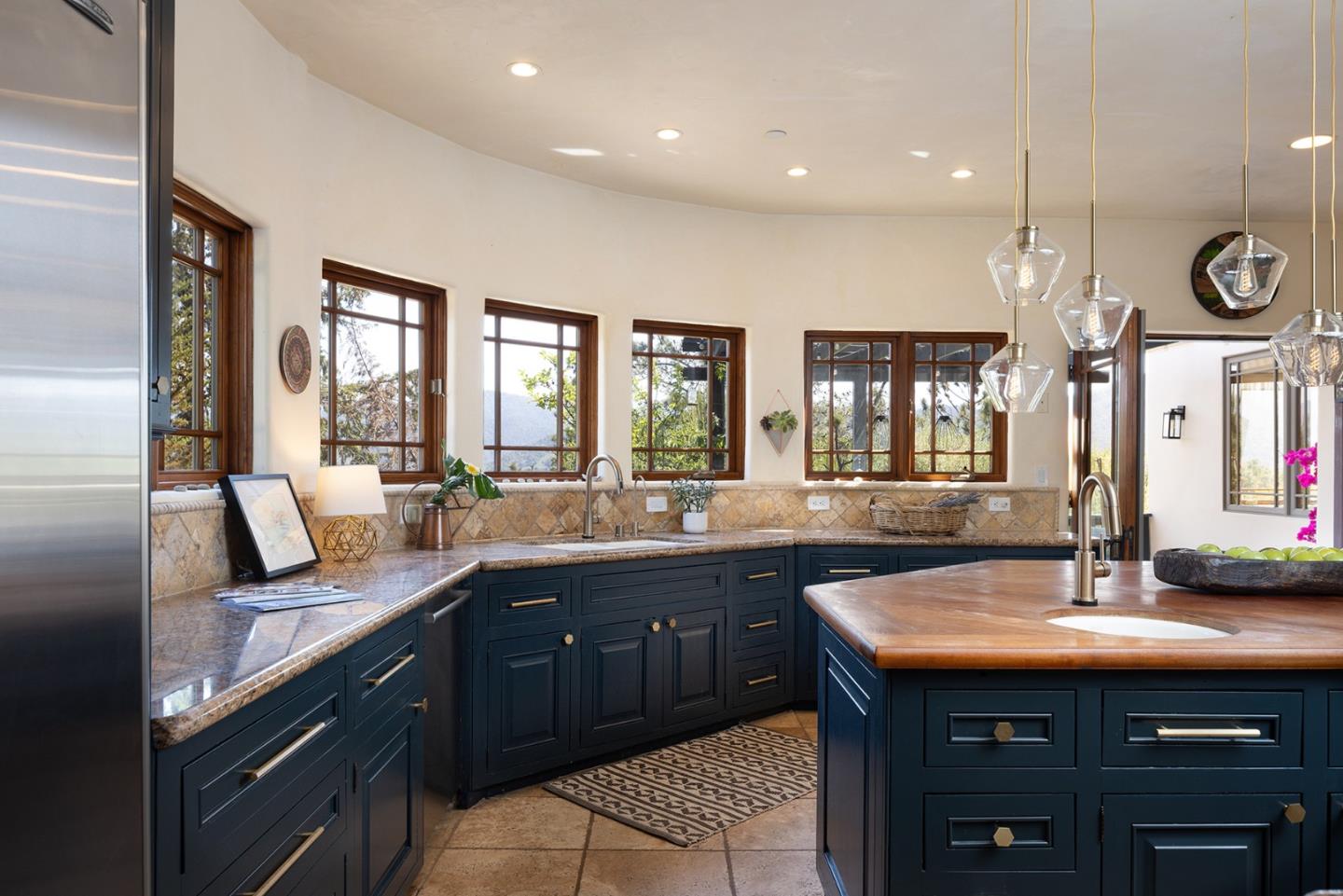 175 Chaparral Road Carmel Valley, CA 93924 - Photo 15 of 40 a large kitchen with a sink and large windows