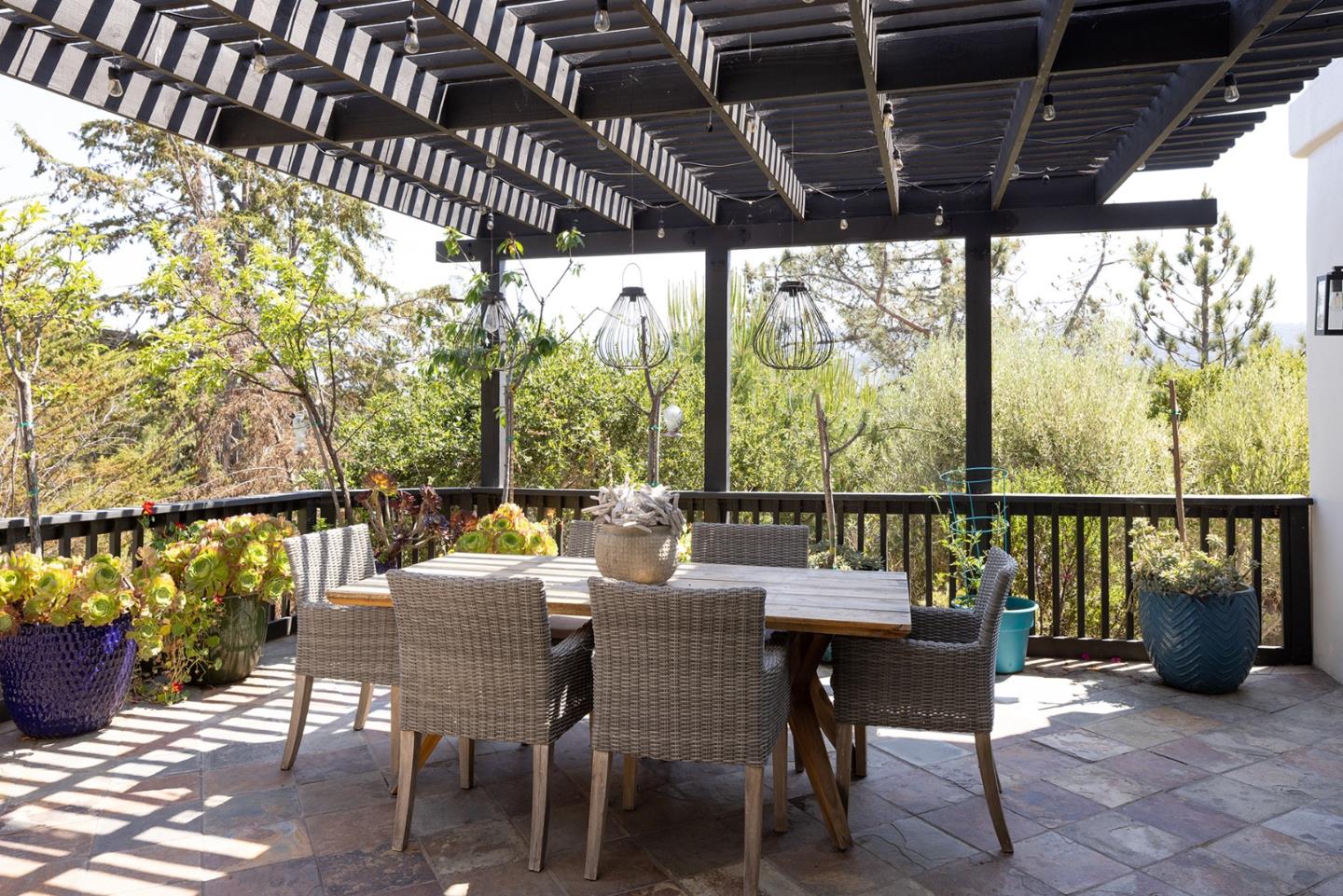 175 Chaparral Road Carmel Valley, CA 93924 - Photo 17 of 40 a view of a chairs and table in patio