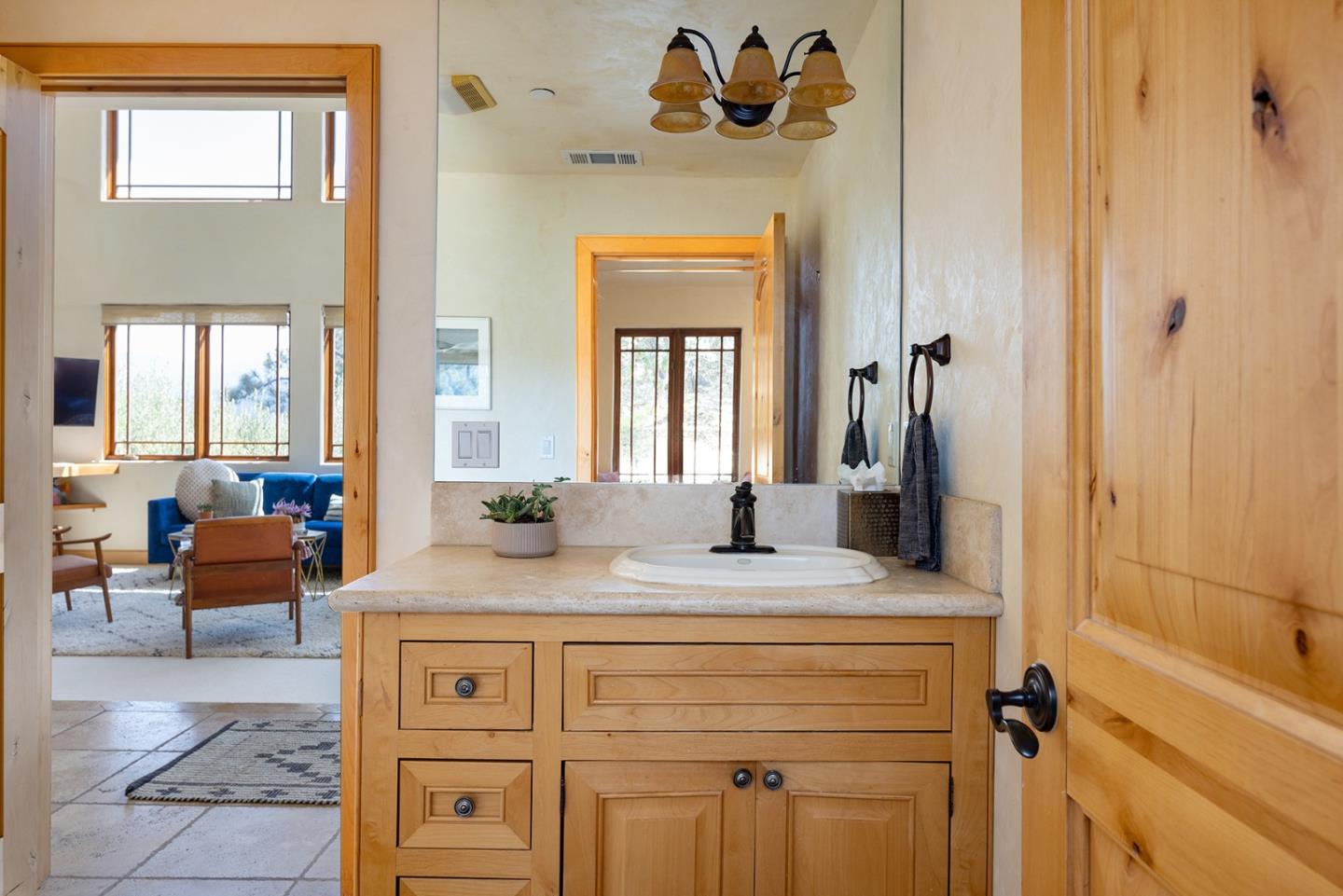 175 Chaparral Road Carmel Valley, CA 93924 - Photo 20 of 40 a bathroom with a sink a vanity and a mirror