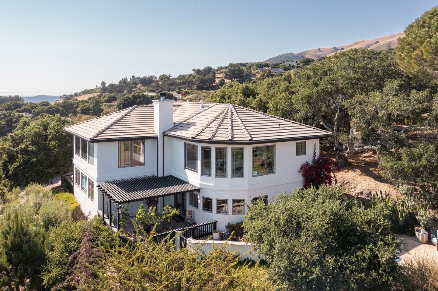 175 Chaparral Road Carmel Valley, CA 93924 - Photo 2 of 40 a aerial view of a house next to a yard
