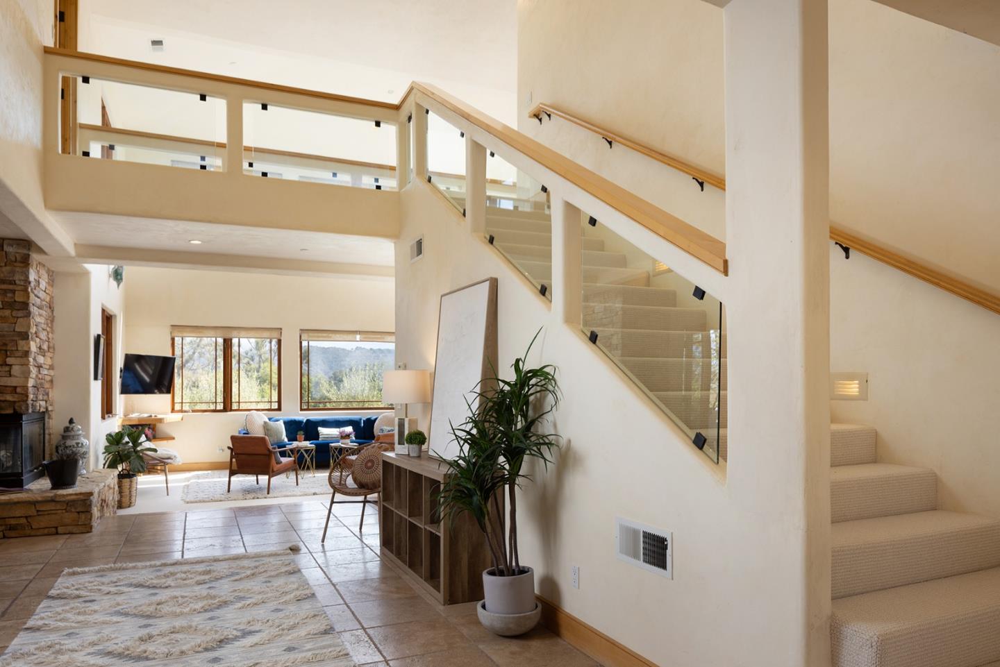 175 Chaparral Road Carmel Valley, CA 93924 - Photo 21 of 40 a living room with furniture and a potted plant