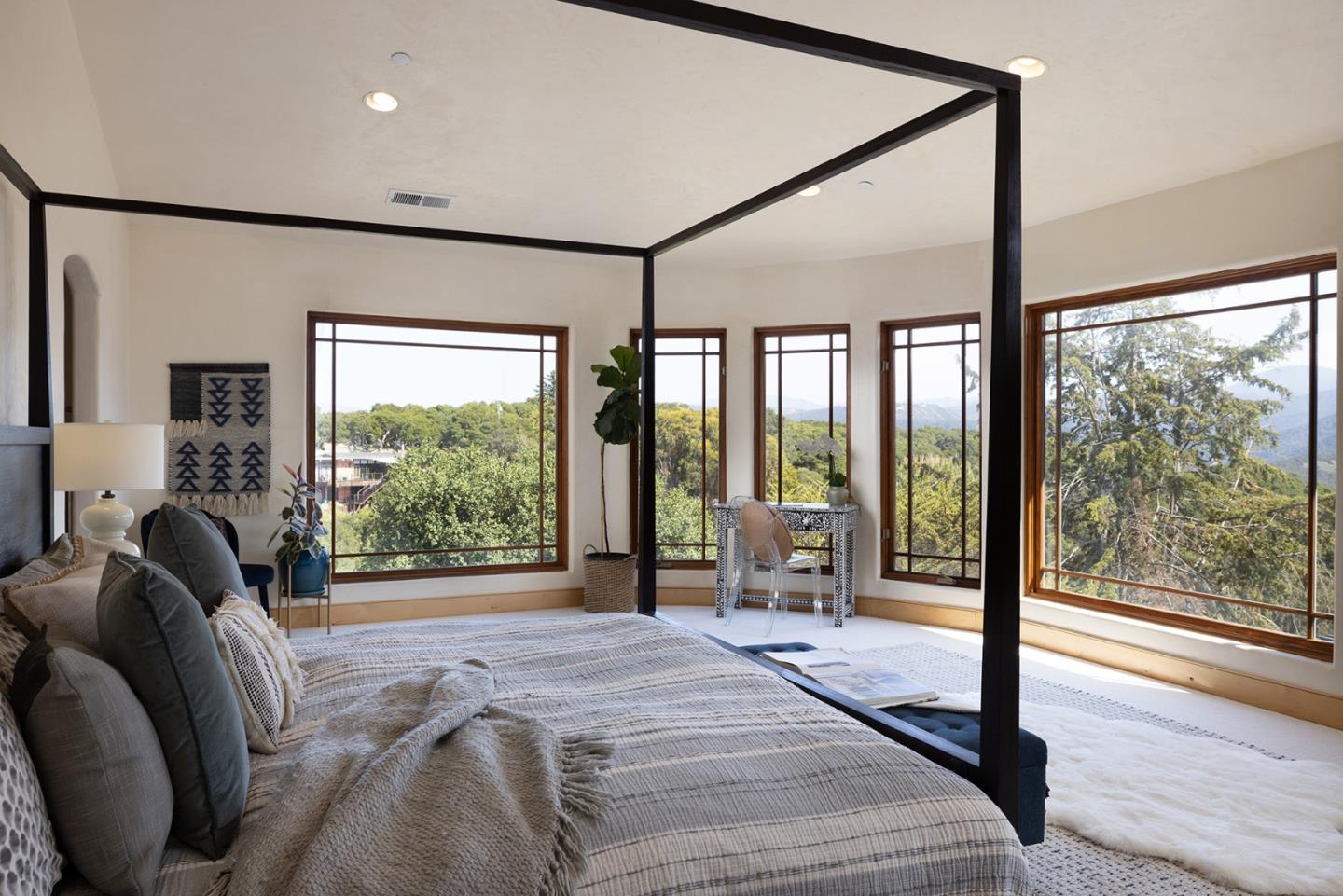 175 Chaparral Road Carmel Valley, CA 93924 - Photo 23 of 40 a spacious bedroom with a large window and a balcony