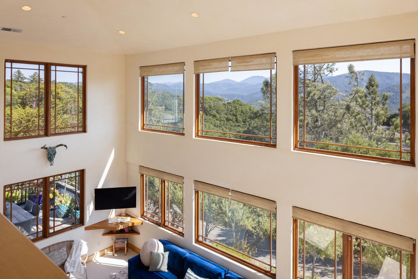 175 Chaparral Road Carmel Valley, CA 93924 - Photo 29 of 40 a living room with furniture a flat screen tv and a window