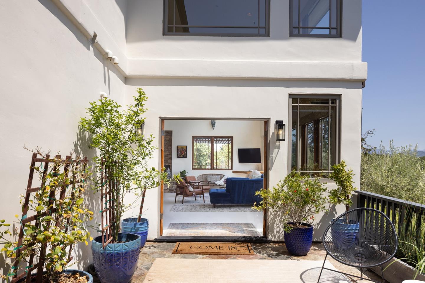 175 Chaparral Road Carmel Valley, CA 93924 - Photo 3 of 40 a living room with furniture and a potted plant