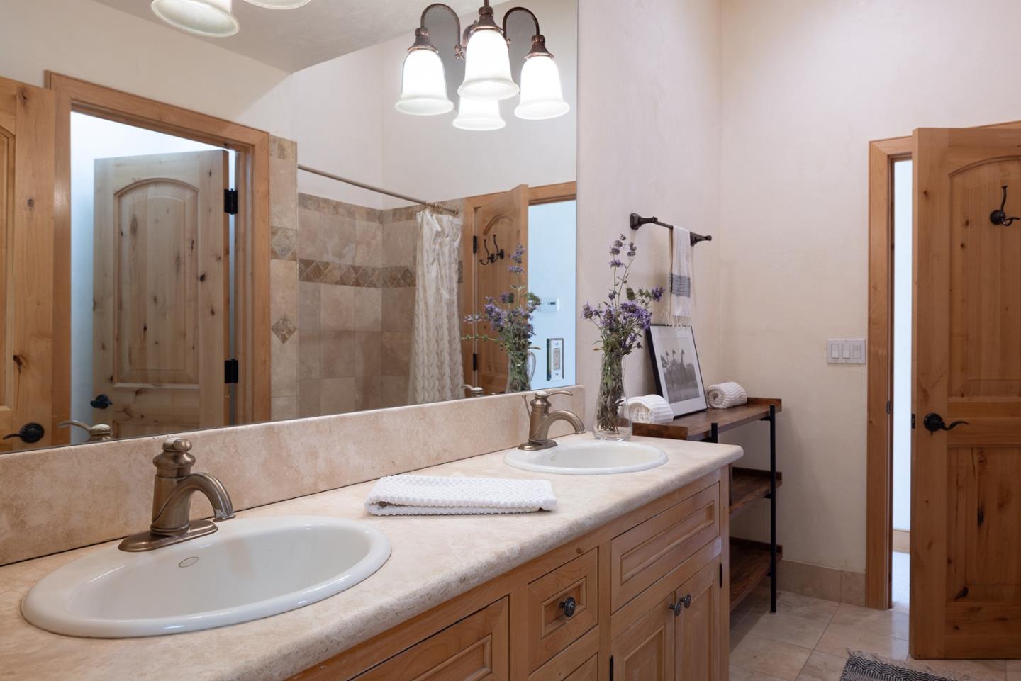 175 Chaparral Road Carmel Valley, CA 93924 - Photo 33 of 40 a bathroom with a sink and a mirror