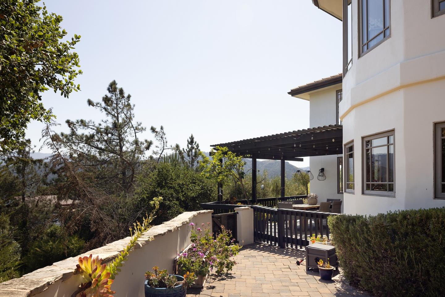 175 Chaparral Road Carmel Valley, CA 93924 - Photo 37 of 40 a balcony with furniture and umbrella