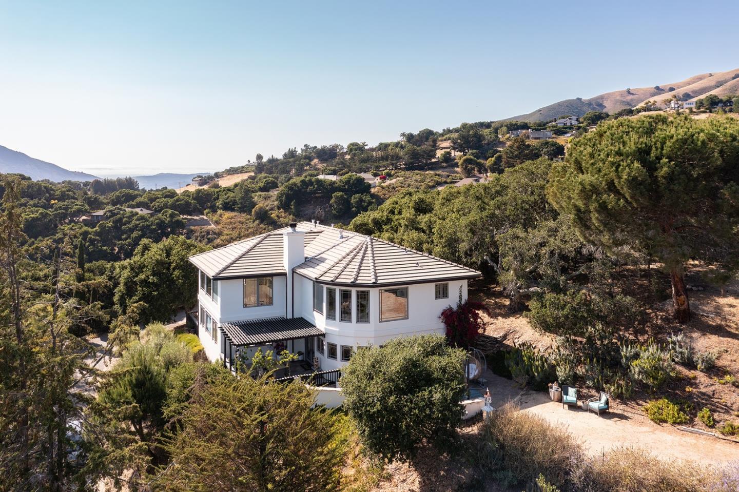175 Chaparral Road Carmel Valley, CA 93924 - Photo 38 of 40 a aerial view of a house with a yard and balcony