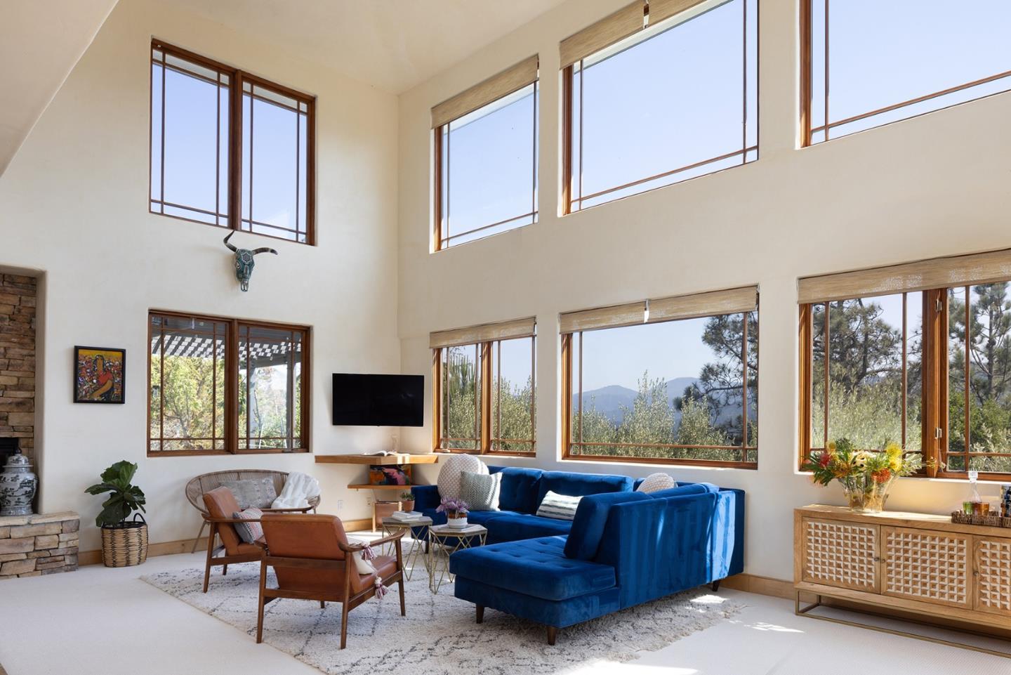 175 Chaparral Road Carmel Valley, CA 93924 - Photo 5 of 40 a living room with furniture tv and large window