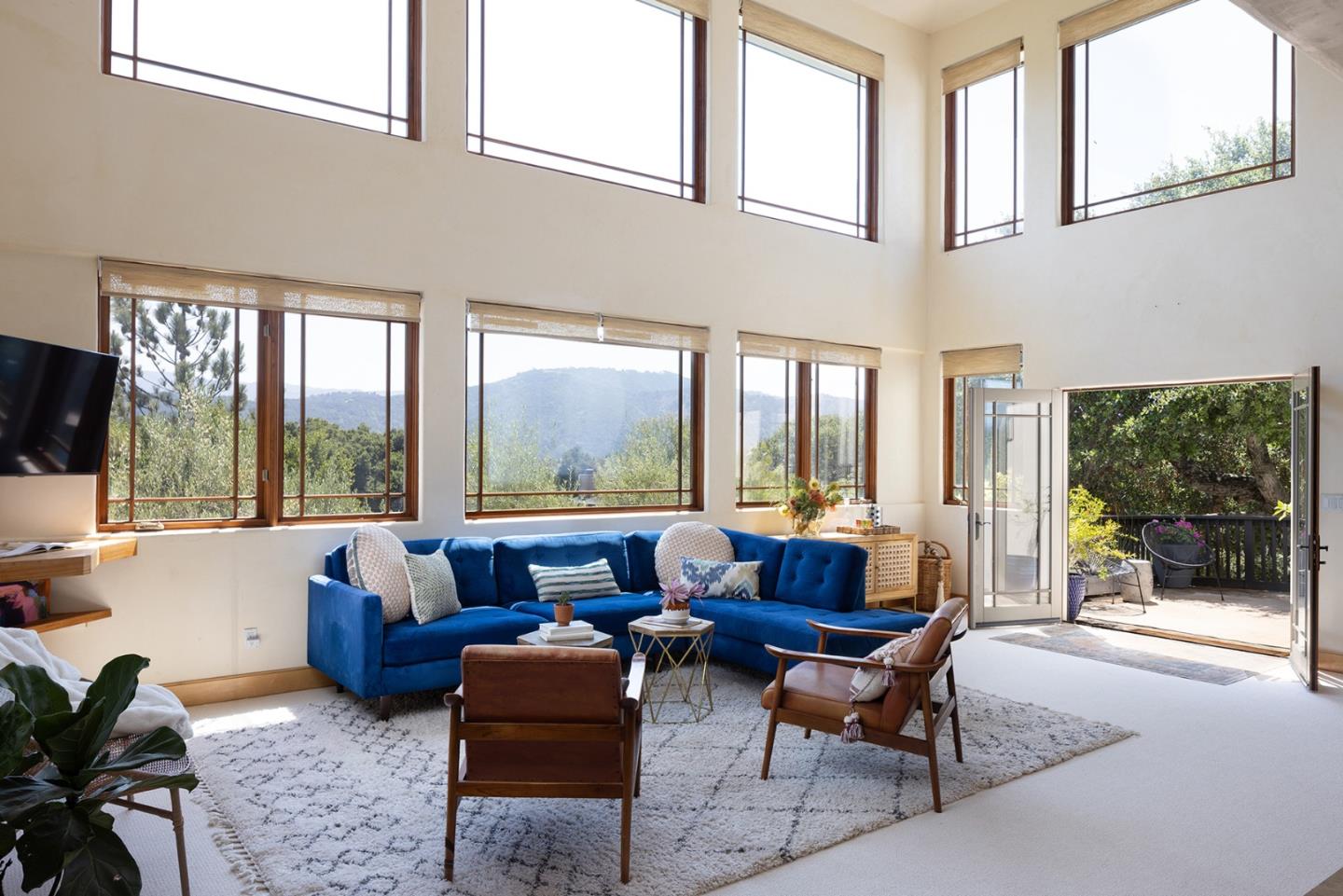 175 Chaparral Road Carmel Valley, CA 93924 - Photo 6 of 40 a living room with furniture and a flat screen tv