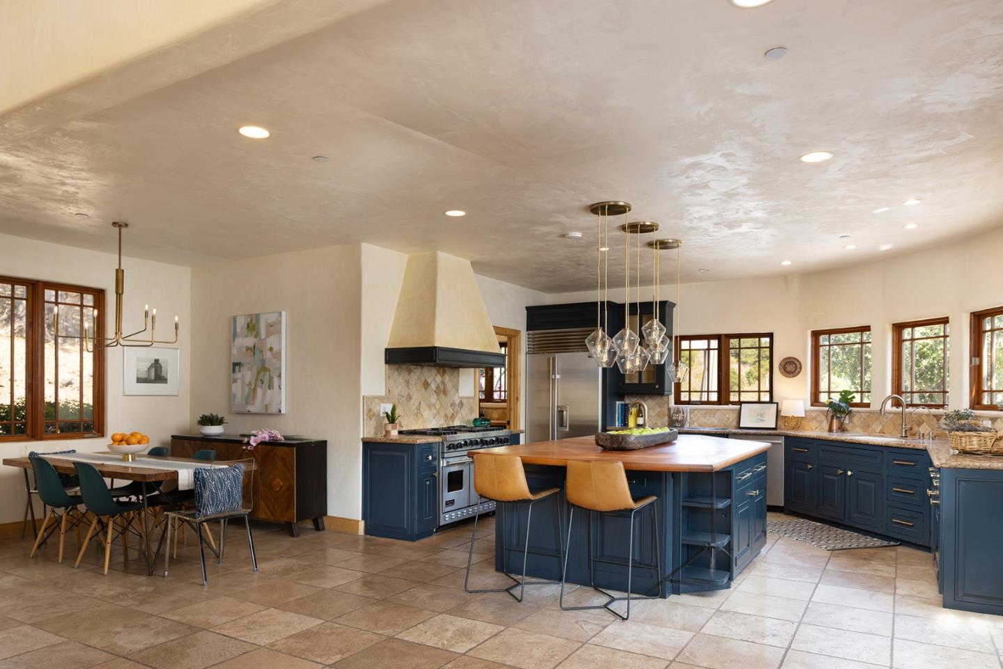 175 Chaparral Road Carmel Valley, CA 93924 - Photo 10 of 40 a living room with lots of furniture and kitchen view