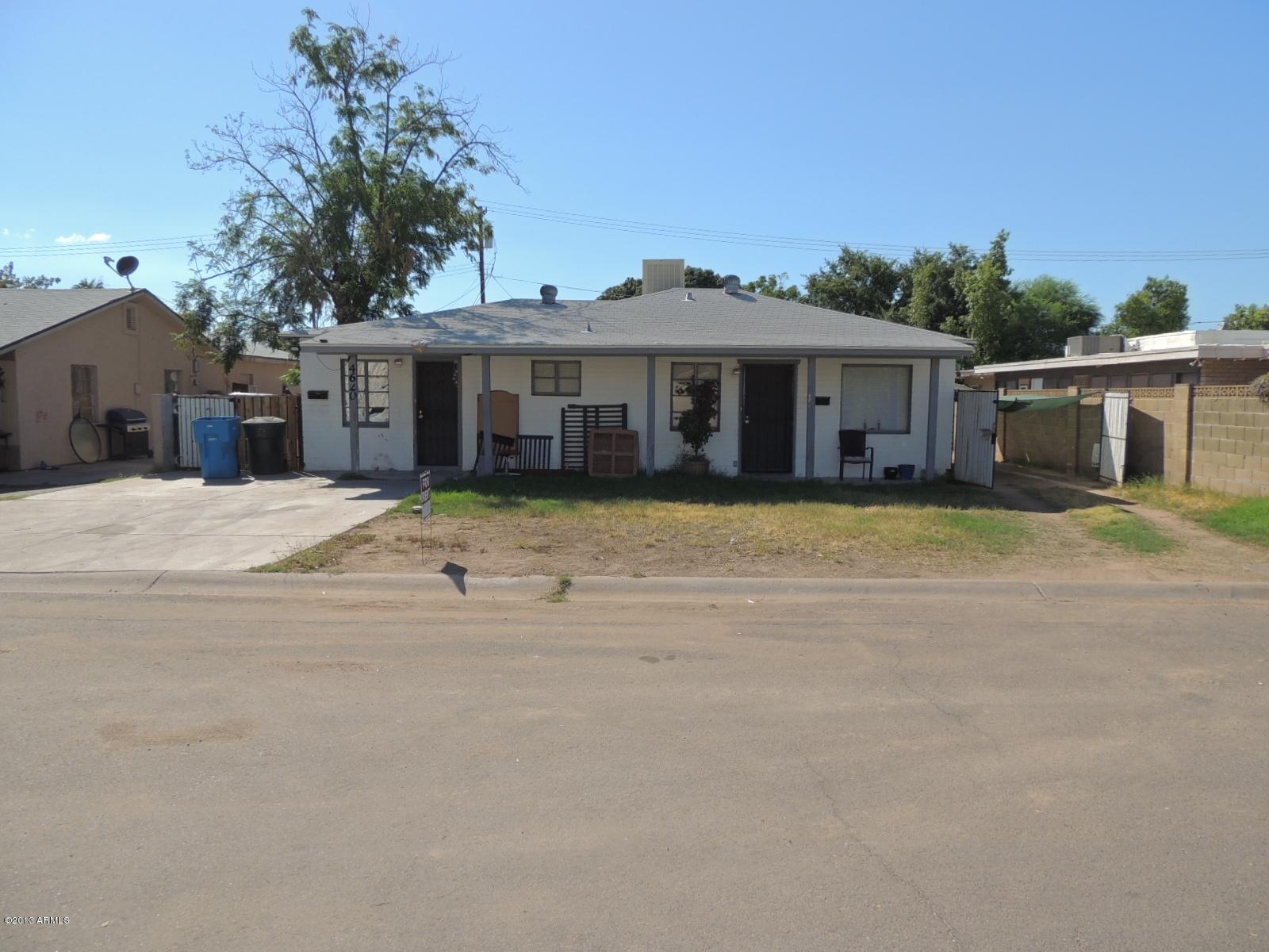 4620 North 10th Place Phoenix, AZ 85014 - Photo 1 of 19 a view of a house with a big yard and large trees