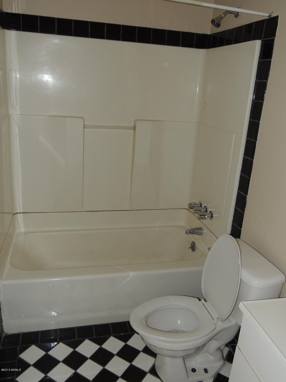 4620 North 10th Place Phoenix, AZ 85014 - Photo 15 of 19 a bathroom with a toilet and a shower