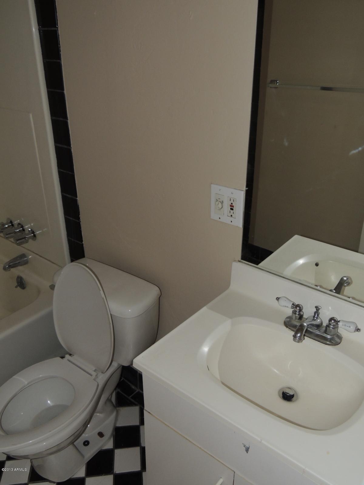4620 North 10th Place Phoenix, AZ 85014 - Photo 16 of 19 a bathroom with a sink and a toilet