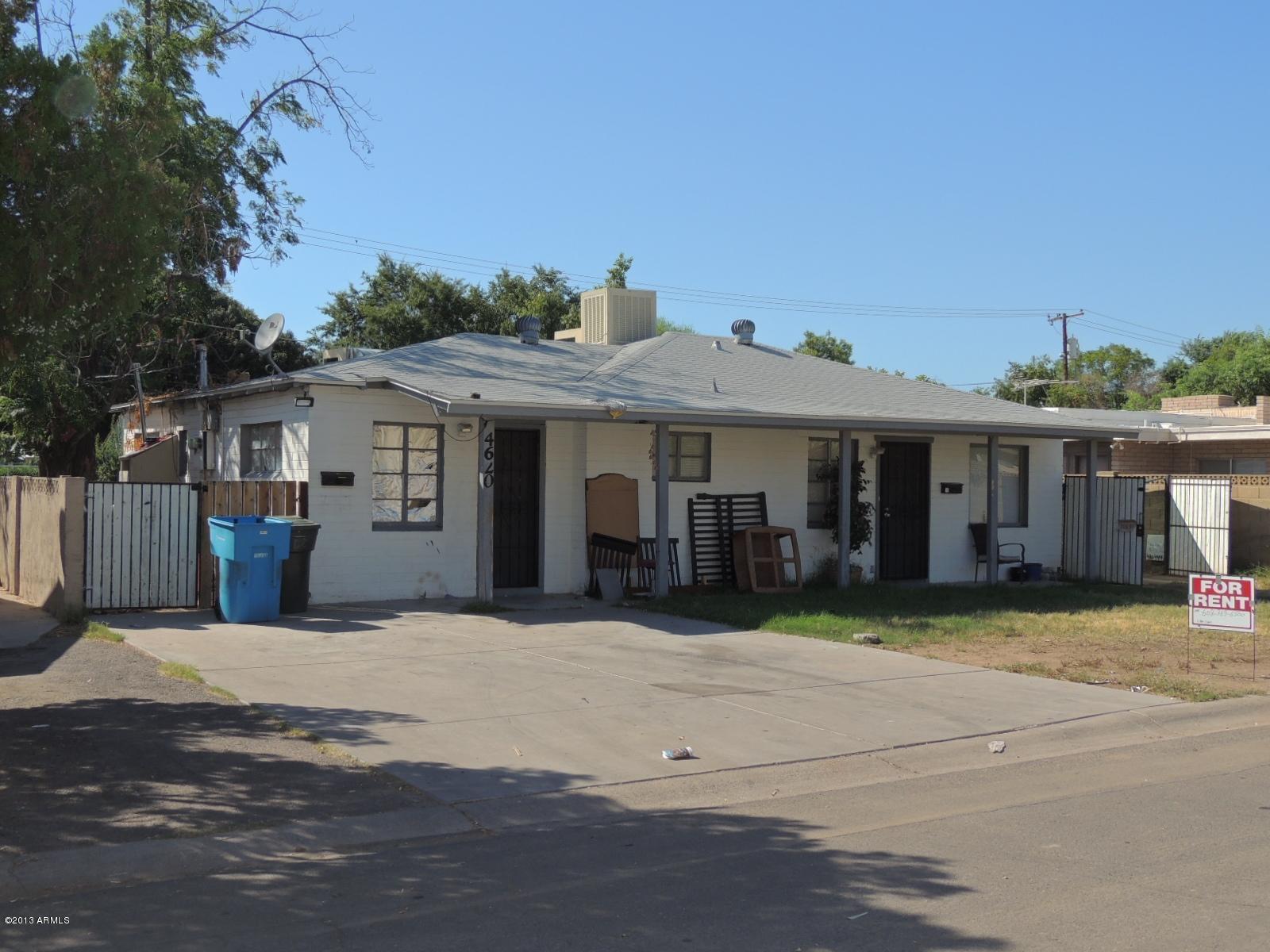 4620 North 10th Place Phoenix, AZ 85014 - Photo 3 of 19 a front view of a house with a yard and potted plants