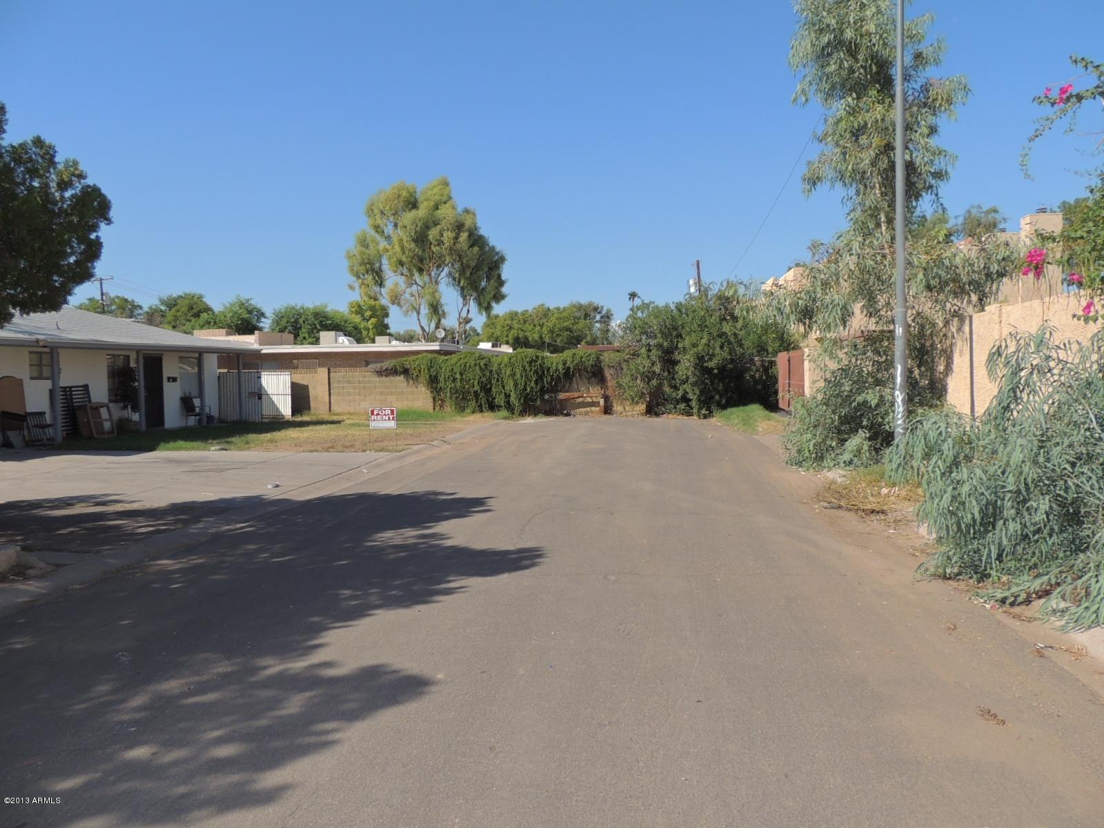 4620 North 10th Place Phoenix, AZ 85014 - Photo 5 of 19 a view of a house with a yard and potted plants