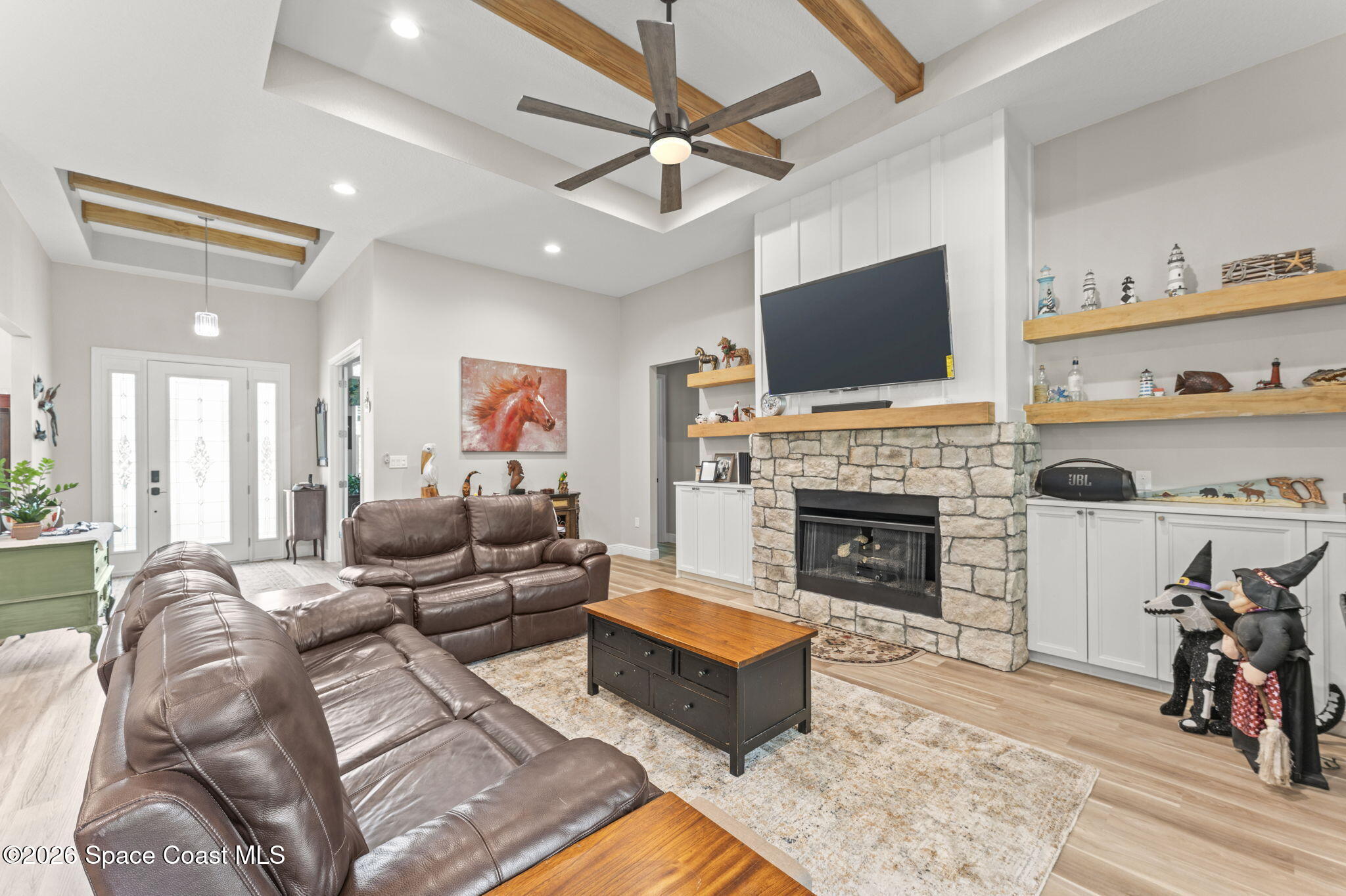1740 Ford Road Mims, FL 32754 - Photo 10 of 43 a living room with furniture fireplace and flat screen tv