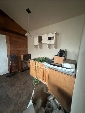 a kitchen with stainless steel appliances granite countertop a sink and a stove
