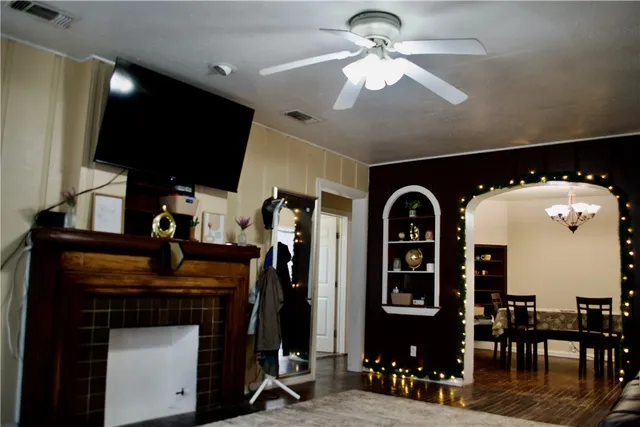 a view of a livingroom with furniture and a flat screen tv