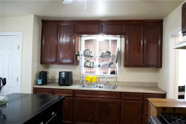 a kitchen with a sink and cabinets