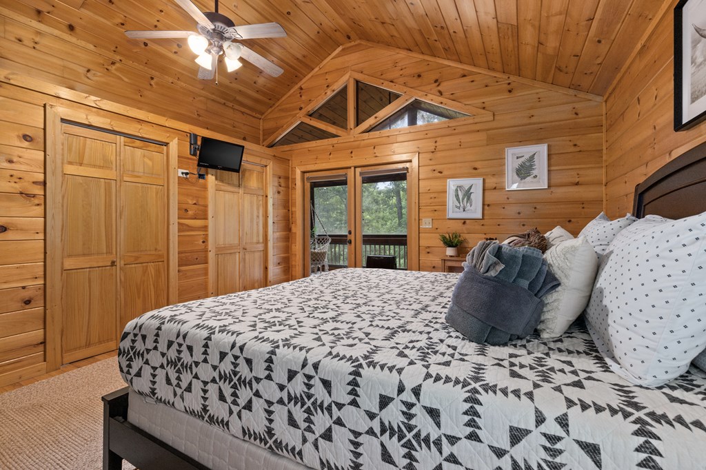 220 Solar Drive Blue Ridge, GA 30513 - Photo 35 of 59 a bedroom with a bed and a large window