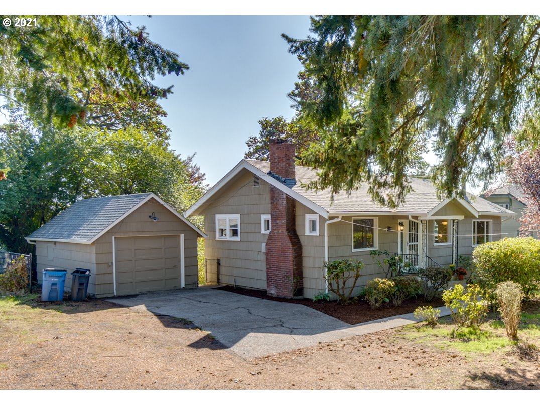 1928 Southwest 6th Avenue Camas, WA 98607 - Photo 2 of 31 a view of a yard in front of a house with large windows