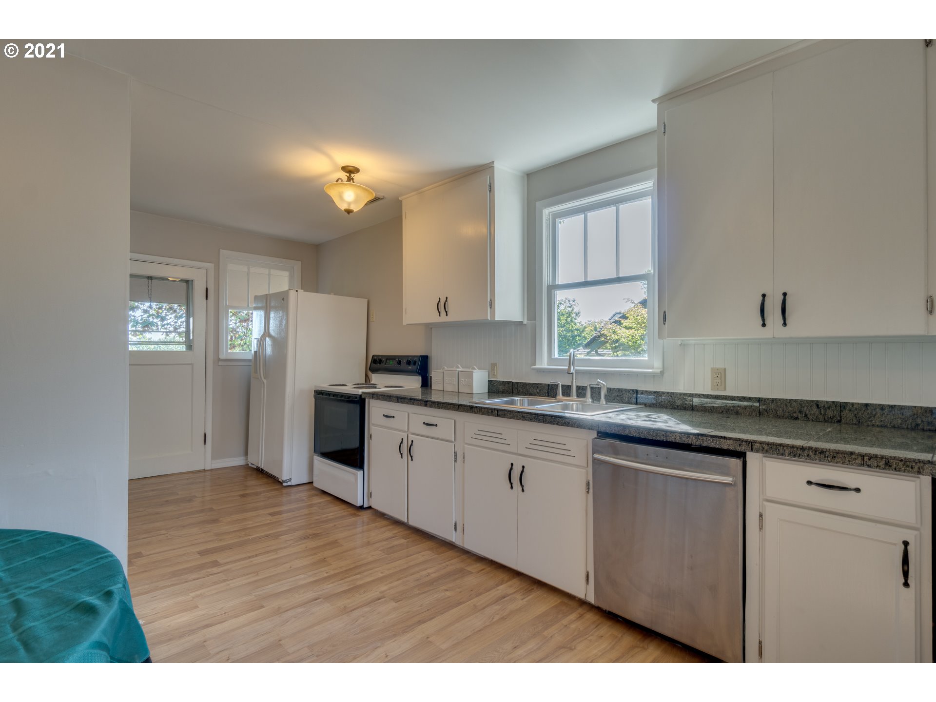 1928 Southwest 6th Avenue Camas, WA 98607 - Photo 13 of 31 a kitchen with granite countertop a sink cabinets stainless steel appliances and a window
