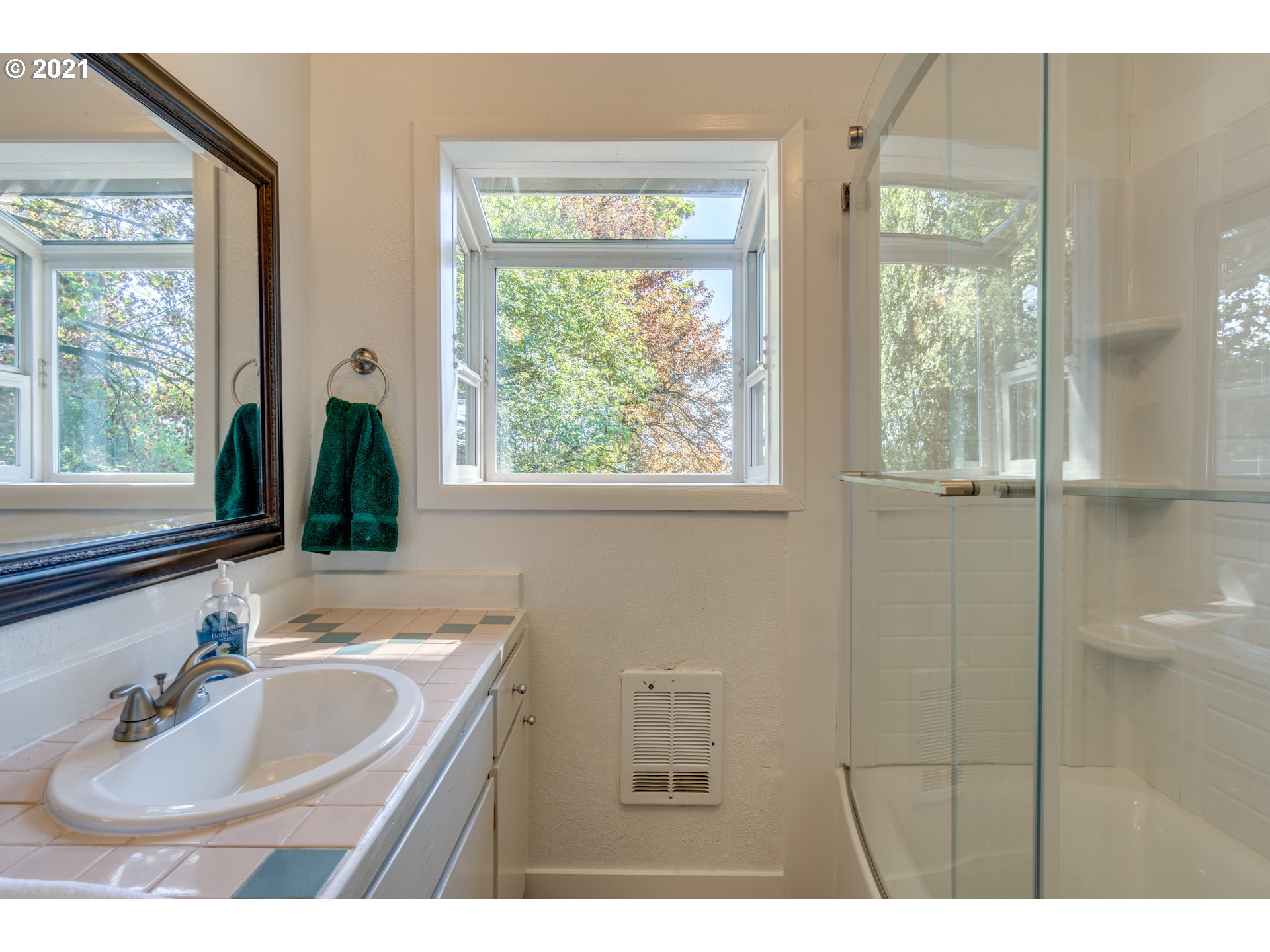 1928 Southwest 6th Avenue Camas, WA 98607 - Photo 16 of 31 a bathroom with a sink a toilet and a window